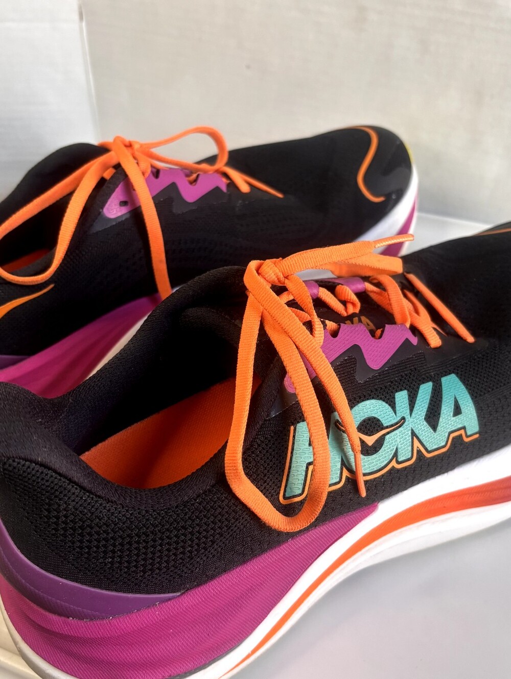 Hoka men's Black Athletic Shoes with Pink, Orange & Teal Accents